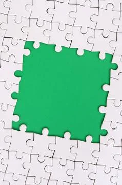 Framing in the form of a rectangle, made of a white jigsaw puzzle around the  Foto stock