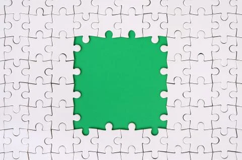 Framing in the form of a rectangle, made of a white jigsaw puzzle around the  Foto stock