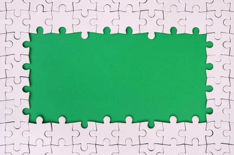 Framing in the form of a rectangle, made of a white jigsaw puzzle around the  Foto stock