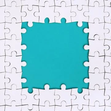 Framing in the form of a rectangle, made of a white jigsaw puzzle around the  Foto stock
