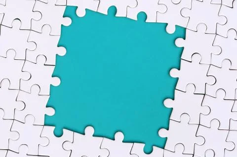 Framing in the form of a rectangle, made of a white jigsaw puzzle around the  Foto stock