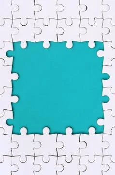 Framing in the form of a rectangle, made of a white jigsaw puzzle around the  Foto stock