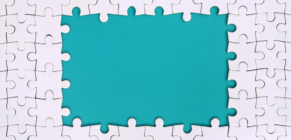 Framing in the form of a rectangle, made of a white jigsaw puzzle around the  写真素材