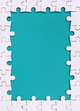 Framing in the form of a rectangle, made of a white jigsaw puzzle around the  Foto stock