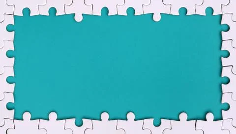 Framing in the form of a rectangle, made of a white jigsaw puzzle around the  Foto stock