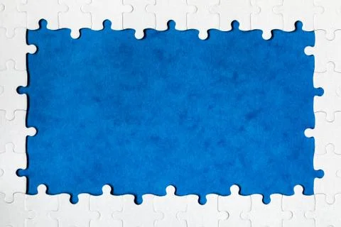 Framing in the form of a rectangle, made of a white jigsaw puzzle. Frame text Foto stock