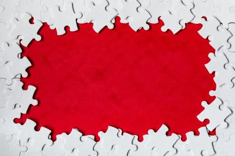 Framing in the form of a rectangle, made of a white jigsaw puzzle. Frame text Foto stock