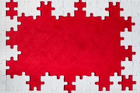 Framing in the form of a rectangle, made of a white jigsaw puzzle. Frame text Foto stock