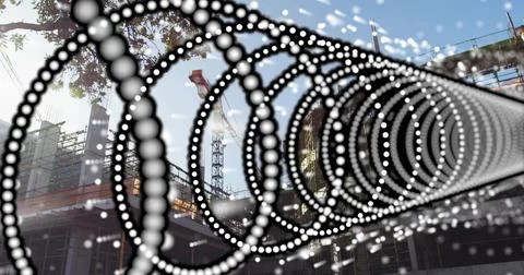 Framing right foreground, dotted spiral leading to site with crane, scaffold, Stock Photos