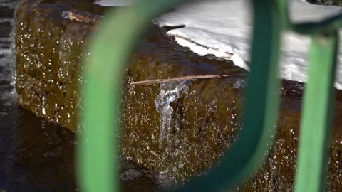 Framing. The wand got stuck in the waterfall. An icicle hangs from a shelf Stock Footage 303152027
