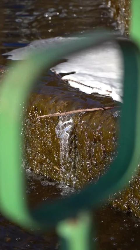 Framing. The wand got stuck in the waterfall. An icicle hangs from a shelf Stock Footage 303152046