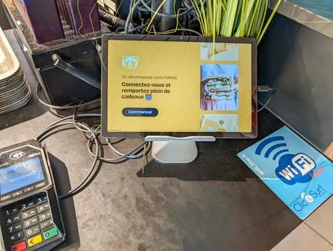 France, 13 August 2024 : Tablet Display Offering Rewards for Customer Loyalty Stock Photos