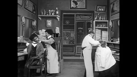 FRANCE - 1908 - In this silent comedy, a black man (an actor in blackface) gets Stock Footage 340575407