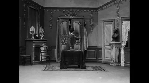FRANCE - 1908 - In this silent comedy, customers arrive for wardrobe fittings at Stock Footage 341993194