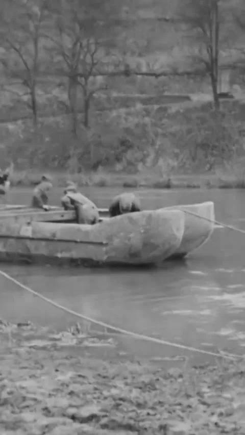 FRANCE - 1918 - US Army Engineers row boats into place to construct and complete Stock Footage 342844915