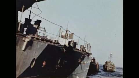 FRANCE - 1944: deck crew work lines as patrol craft steam in formation Stock Footage 340221879