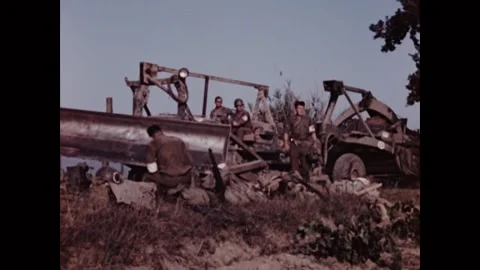 FRANCE - 1944 - US Army Engineers begin bulldozing a French vineyard to build an Video stock 340577845