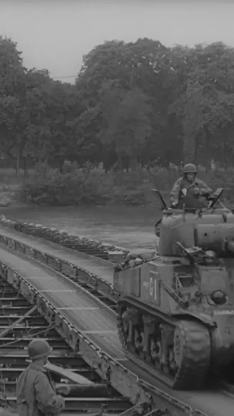 FRANCE - 1944 - US Army engineers construct pontoon bridges across a French Stock Footage 342952008