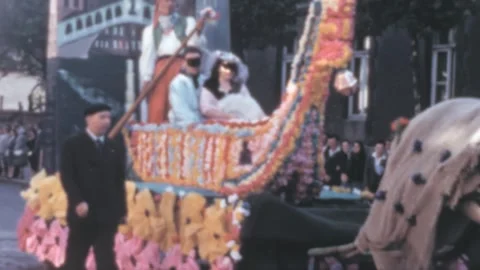 France - 1956: horse pulls a float with a Venice gondola during a float parade Stock Footage 256163783
