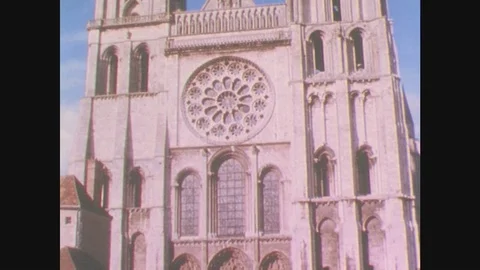 France 1960s: Large stone cathedral. Cathedral spires against the sky. Stock Footage