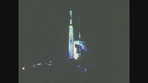 France 1960s: Rocket at launch base at night. Man on foggy, railed bridge Stock Footage