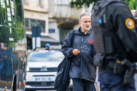 France, 22 May 2024 : Man Walking on Street Near Police Car and Officers Stock Photos