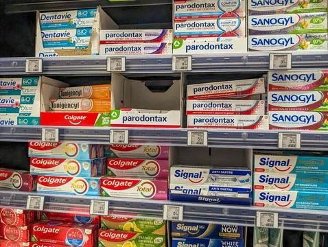 France, 23 May 2024: Toothpaste products on shelves in a supermarket. Stock Photos