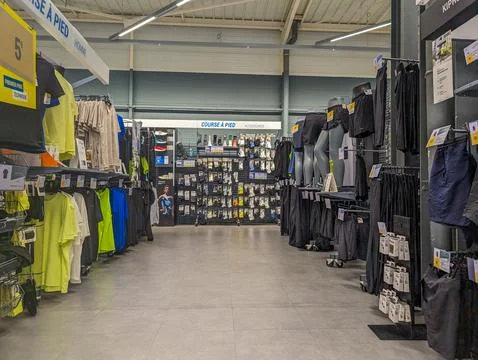 France, 9 May 2024: Interior of sports retail store with clothing and acces.. Foto stock