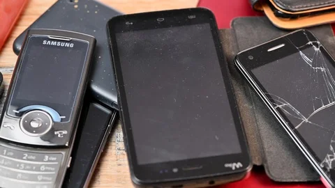 France-April 24, 2019, outdated models of mobile phones and smartphones  Stock Footage 106925233