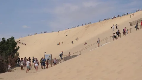 France, Arcachon and the Dune of Pilat and many tourists climbing the sand 2 Stock Footage 340021253