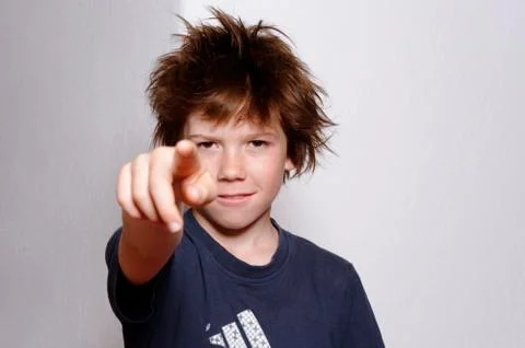 France, boy standing and pointing out Stock Photos