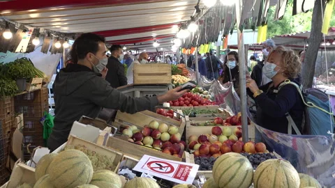 France coronavirus second wave, face masks at fruit vegetable market Paris Stock Footage 139688238