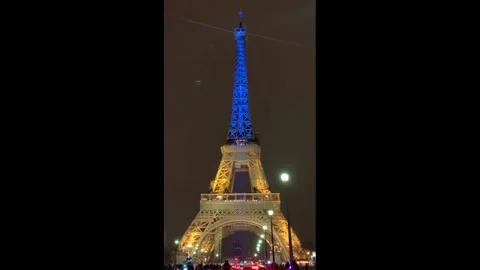 France: Eiffel Tower Lights Up In Colors Of Ukrainian Flag Before Invasion A... Stock Footage 233990426