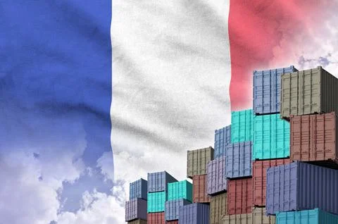 France flag and big stack of shipping cargo containers in docks with sky Foto stock