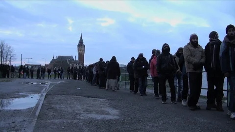 France January 2015 - Refugees queue up for food at a volunteer distribution Stock Footage 86624012