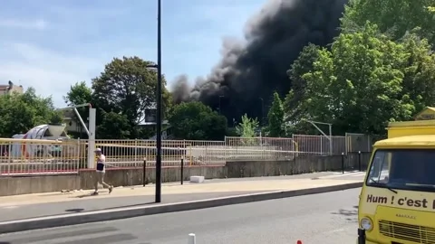 France: Massive Fire Erupts At Textile Warehouse In Aubervilliers 3 Stock Footage 243754701
