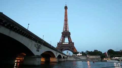 France - Paris - Eiffel Tower at Dusk as Boat Goes By Stock Footage 8919926