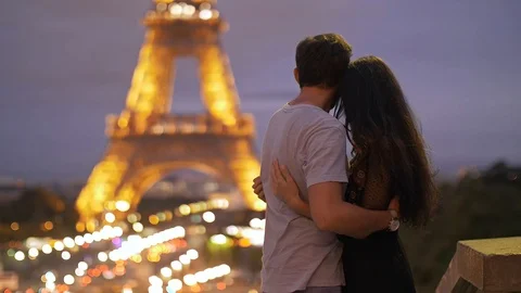 FRANCE, PARIS - OCT 2, 2017: Romantic Couple in love in Paris at Eiffel Tower in Stock Footage 98410467