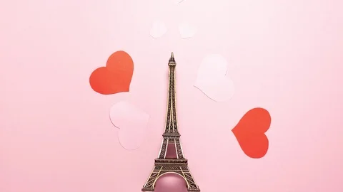 France Paris small Eiffel Tower on pink with hearts flat lay Stock Footage 123808935