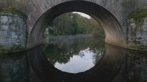 France Uzerche though roman bridge river Stock Footage 233283320