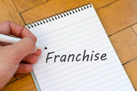 Franchise text concept on notebook Stock Photos