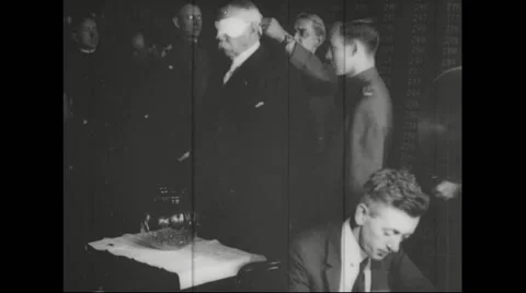 Francis E. Warren being blind folded before drawing draft number from glass jar Stock Footage