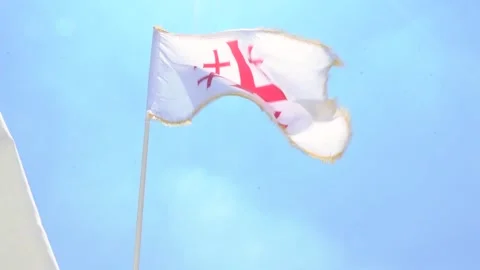 FRANCISCANS JERUSALEM CROSS FLAG FLYING Stock Footage 145390773