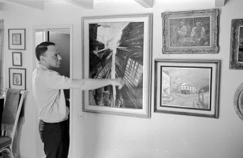 Frank Sinatra shows off his affinity for art with his personal collection of pai Stock Photos
