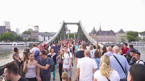 FRANKFURT, GERMANY, AUGUST 2017, Crowd of people walking on bridge Stock Footage