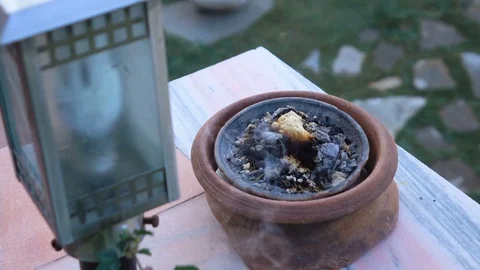 Frankincense burning on a hot coal, used for religious rites Stock Footage 93354250