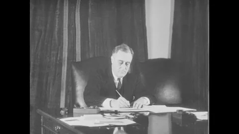 Franklin D. Roosevelt signs the document Stock Footage 296069155