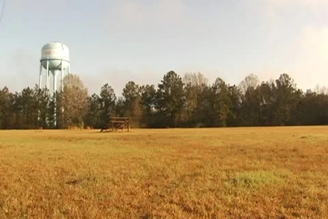Franklinton Water Tower, Single Bleacher in field in foreground Stock Footage 10765102