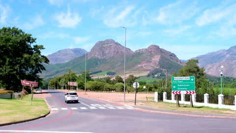 Franschhoek three-way stop intersection next to Huguenot Monument Stock Footage 304131145