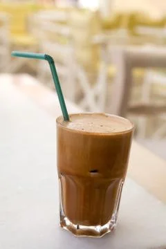 Frappe on a cafe table Stock Photos